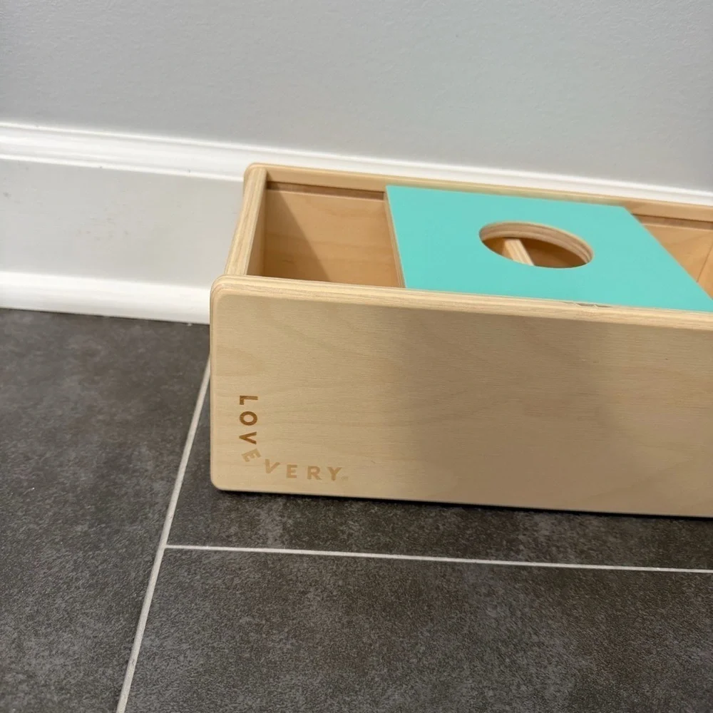 Lovevery Sliding Top Box with Plastic Rattle Ball from the Thinker Play Kit